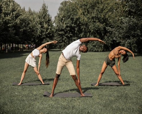 Man stretching outdoors in a park